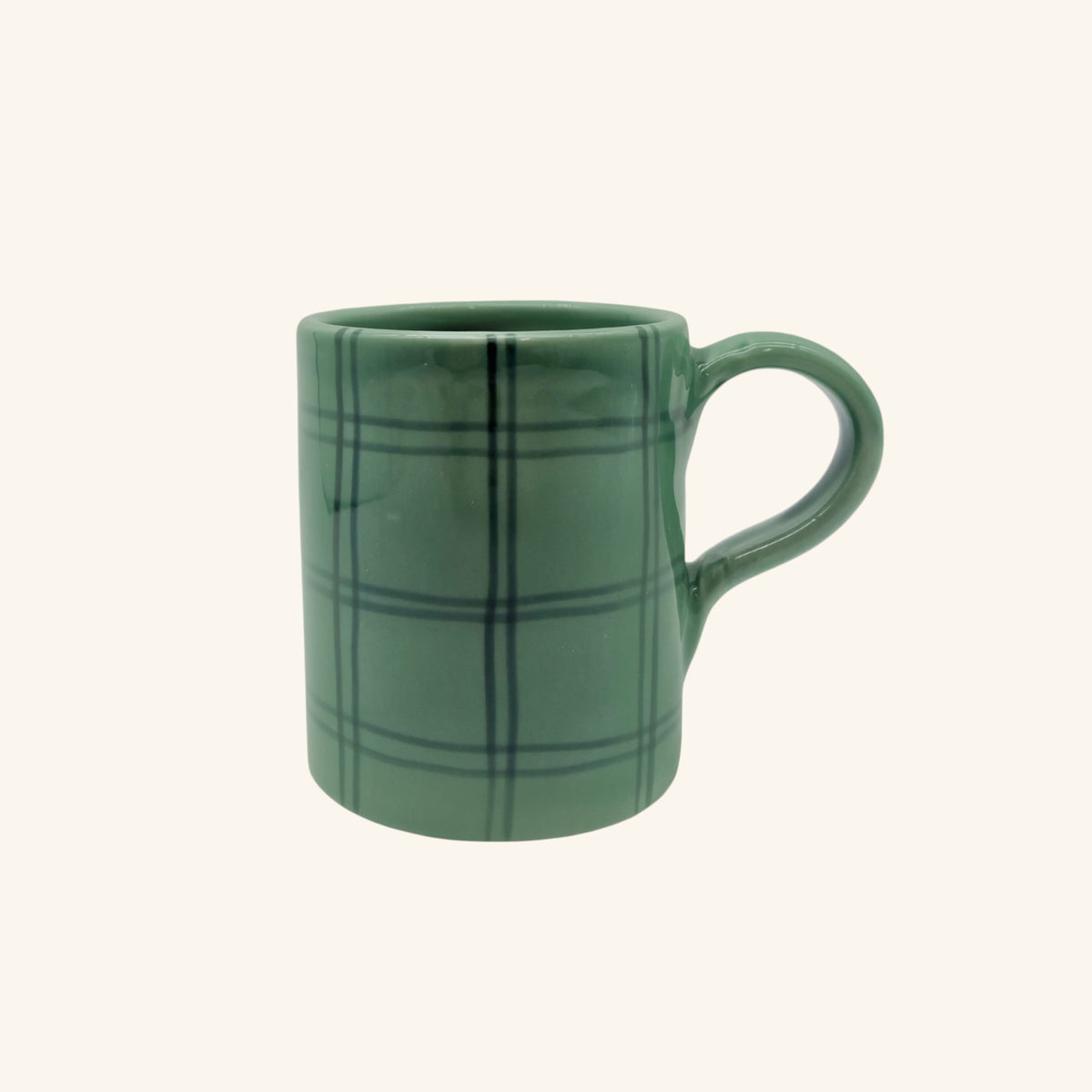 Green plaid mug on a white background