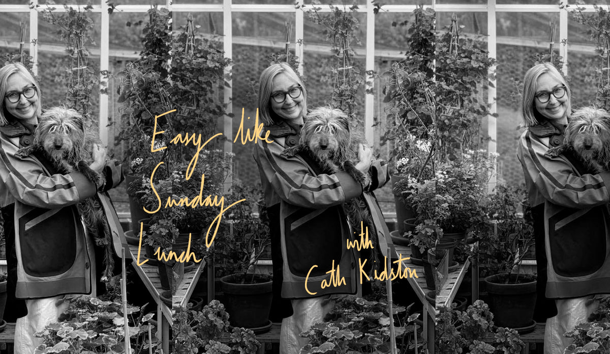 Cath Kidston in her greenhouse with her dog