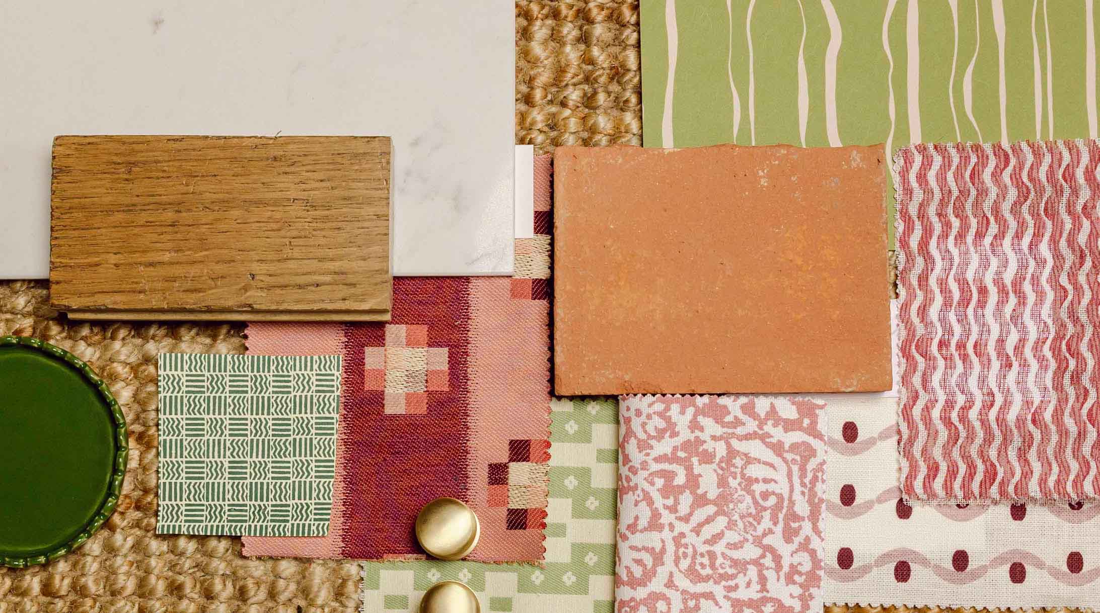 Collection of fabric swatches with various patterns and colors on a textured surface. LAMP LDN LIVING